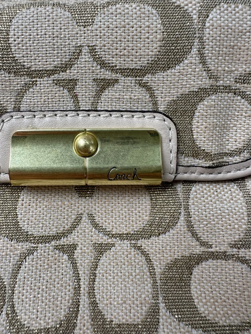 Coach Kristin Signature Crossbody Swing Bag in a metallic gold and beige fabric